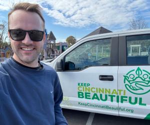 webFEAT Complete's Justin Marshall Stanading next to Keep Cincinnati Beautiful's Truck