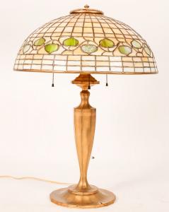 Authentic Tiffany Studios (N.Y.) three-bulb table lamp with a 16-inch diameter Favrile leaded glass Acorn design shade and gilt bronze base, 22 inches in height, zero flaws ($18,750).