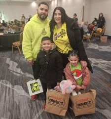 Over 100 children received gifts at GLVADA's Children's Christmas Luncheon including Omarelys, age 4 and Justin, age 8 of Bethlehem, Pa.