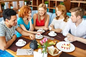 Friends drinking tea and discussing milk first or last