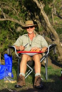 Myles Forsyth camping someone in the outback Australia - exact location unknown.