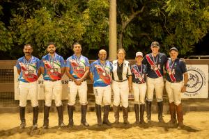 two teams of arena polo players stand for a photo