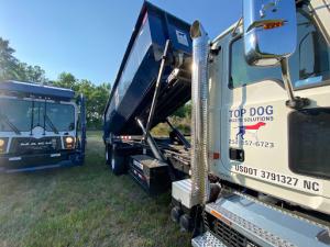 Top Dog Waste Solutions trucks ready for efficient plastic waste collection and recycling services.