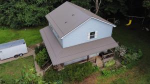 Residential home in Youngstown, OH, with a freshly repaired and winterized roof by Liberty Roofing Pro’s