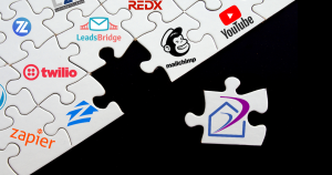 Image showing a nearly completed puzzle, each piece has the icon of a different online Real Estate tool that connects with RealtyJuggler