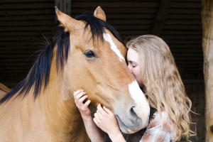 Echo Valley wrangler and her horse