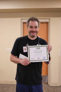 John Little proudly accepts his DAISY award