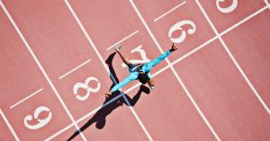 Sports person on running track across numbered positions