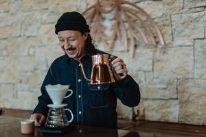 Nick Breheny makes a pourover in the coffee lab at Wonderstate Coffee roastery