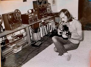 black and white image of man with recording gear