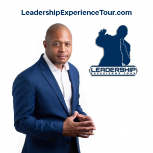 Man in blue suit looking at camera, logo and website for LeadershipExperienceTour.com fetured on white background