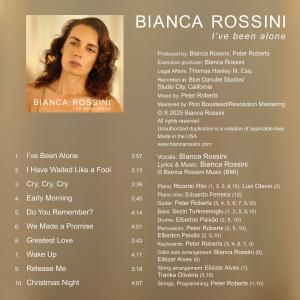 A photo of Bianca Rossini’s I've Been Alone album credits, featuring songwriting credits, a list of songs, names of musicians per song, and other attributions.