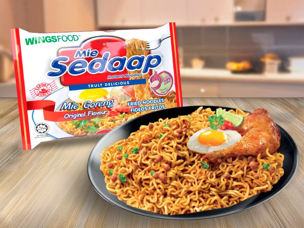 Image of Mi Sedaap instant noodles in a bowl, with rich, flavorful broth and garnished with fresh herbs. The packaging is visible, showcasing the brand's signature logo and vibrant colors.