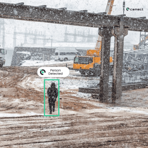 Camect detects intruder through snow, at a distance approaching a private construction side