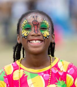 A beautiful face painted smile at the International African Arts Festival 2024.