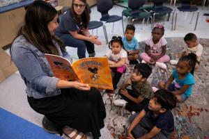 Teacher Reads Students book