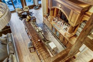 Overlooking the stairs to see this beautiful built in bar and seating area