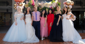 Photo of Trudys Brides and Special Occasions Owners Steven Blechman and Rebekah Blechman pictured with daughter Liliana Blechman and four models wearing wedding dresses at Trudys 50 Years of "Yes to the Dress" Celebration.