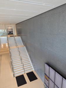 Epoxy terrazzo design: gray terrazzo wall panels in Detroit's Wayne Country Criminal Justice Center