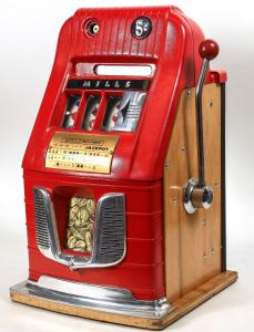 Circa 1950 three-reel Mills Bell-O-Matic slot machine with bright red metal case and wooden sides, the “A-C-E” in clubs the jackpot, 26 inches tall, with two keys (est. $2,000-$4,000).