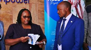 Benvictor Makau, Assistant Director of The Trueness Project, having a chat with Mary Kinyanjui from the Acquisition, Cataloging, Classification and Distribution Department, KNLS. Photo: Godfrey Atsing'a, The Trueness Project.