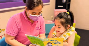 Teacher with kids in classroom at Able Plus Life Skills Development Center