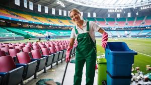 Stadium and Venue Cleaning Forte Cleaning Utah with a lady cleaning in a stadium.