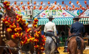 Horse riders at the Feria de Abril, part of Fernwayer's Seville private tours.