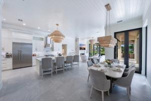 Interior kitchen of 6536 Highcroft Drive with premium appliances, custom cabinetry and a large central island.