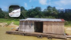 A floating house in The Brazilian Amazon River services by Hughes satellite connectivity solution