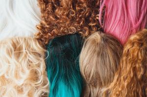 Wigs of different colors and styles for fashion and beauty choices.