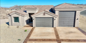 Front view of a modern, affordable house built by Allegiant Homes in Bullhead City, AZ, featuring desert-inspired design and quality craftsmanship