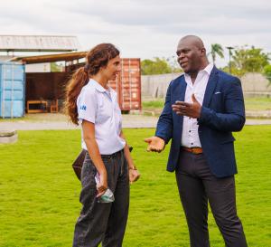 MFK COO Remenson Tenor discusses RUTF manufacturing and distribution with Nour Salamam, World Food Programme's Food Systems Officer.