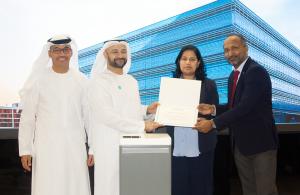 Masdar City Free Zone Director Mr. Amier F. Alawadhi, and Mr. Faraj AlTamimi, CX/FZ of Masdar City Free Zone presents the Official Partner Certificate to Asha Treesa Bejoy, Founder & CEO of ATB Legal Consultancy.