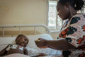 Mother cares for her child in the hospital.