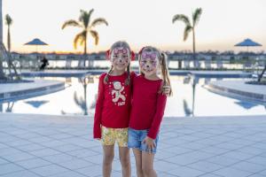 Two Girls With Their Faces Painted At Brystol Amenity Center