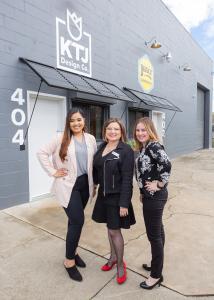 Kathleen Jennison—Owner & Lead Designer of KTJ Design Co., and her team pose outside of  The Shoppe retail store where they meet design clients and run the day to day operation of their nationally recognized firm.