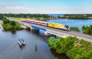 An image of a Brightline Florida train on the HNTB designed Florida East-West Connector.