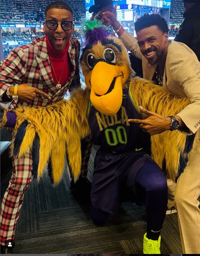 Actor Miguel A. Nunez Jr., Pierre the Pelican the official mascot for the Pelicans, and Apostle Mardia Scott attend a game. His Love is Amazing Movement is a community partner of the Pelicans. Photo: Eye Wander