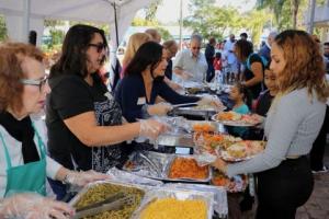 Generosity in action: Volunteers handing out food and spreading holiday cheer during the Christmas Giveaway