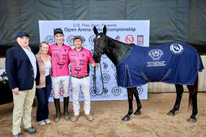 A polo pony stands proudly in her Best Playing pony blanket with her players, owner and USPA dignitary