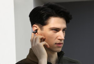 A Man Wearing Soundcore AeroClip Earbuds