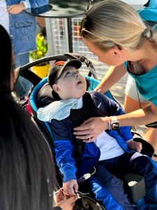 Medically complex pediatric Giants fan with his caring mother at Team Select Home Care’s spring training event at the San Francisco Giants facility in Scottsdale.