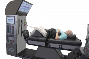 Patient On DRX9000 Lumbar Spinal Decompression Table