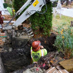 J. Blanton Plumbing technician conducts a plumbing repair service, showcasing the company’s expertise in after-hours plumbing, plumbing maintenance, and preventing spring thaw-related pipe damage.