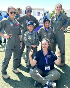 Graciela, with 2 girls at Girls in Aviation Day 2023 and 3 active duty military women aviators