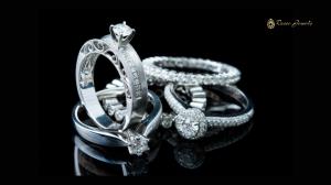 A collection of elegant lab-grown diamond rings from Rosec Jewels, displayed against a sleek black background. The rings feature intricate designs, including solitaire and pavé settings, with brilliant-cut diamonds set in white gold bands.