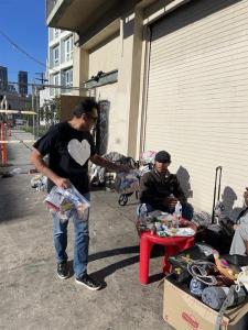 Kenny Dewan distributing food packets and spreading kindness and hope one meal at a time.
