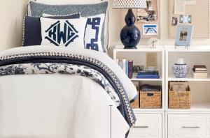 Dorm Room bed with white and blue bedding in classic  Ballard Designs style.
