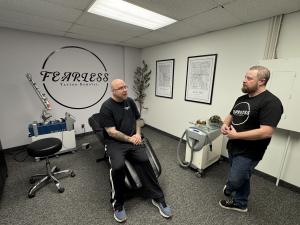 Anthony, Owner of Fearless Tattoo Removal, chatting with first recipient of the program.